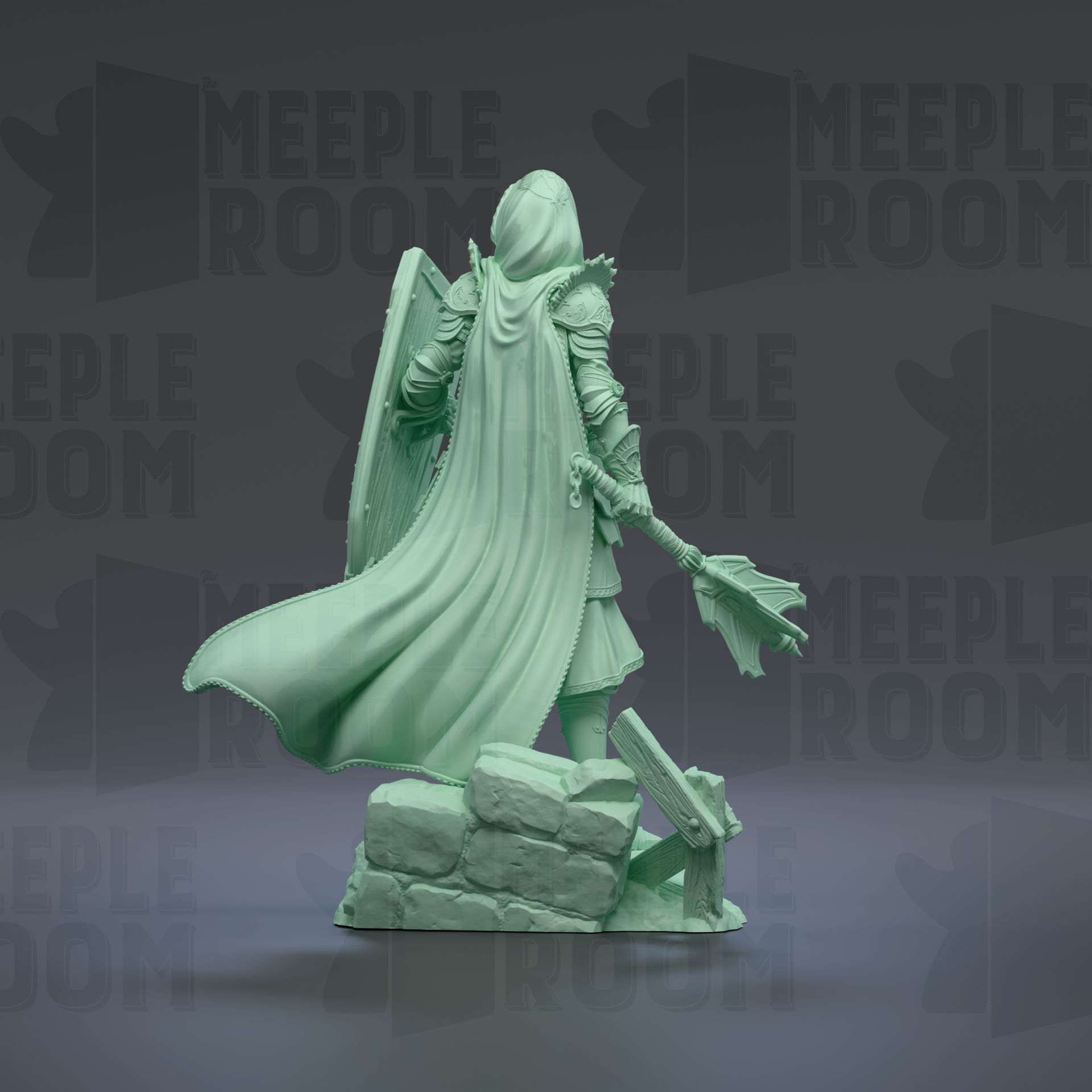 A green statue of a person with a flowing cape and a shield, standing on a rock formation.