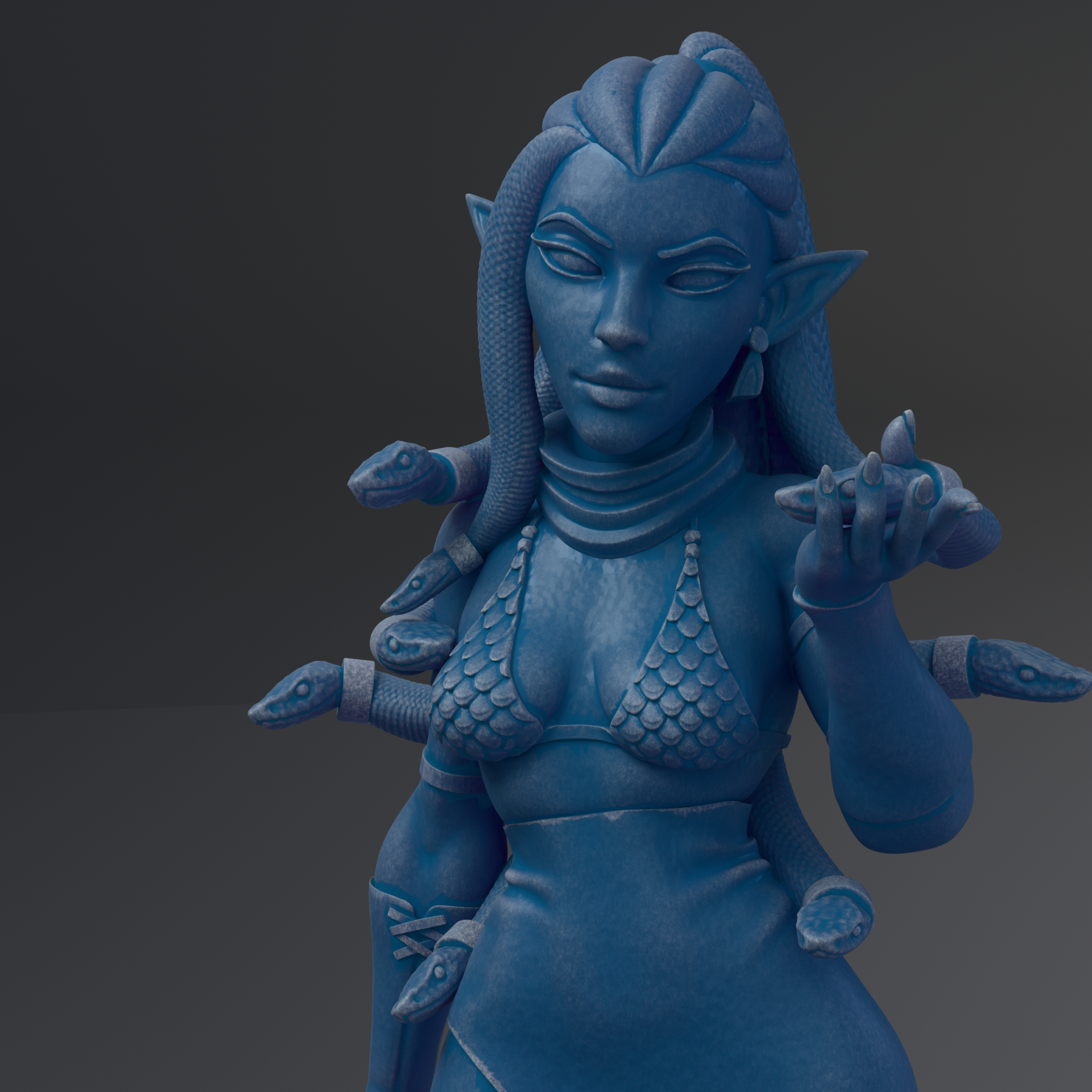 A blue statue of a woman with snakes wrapped around her body.