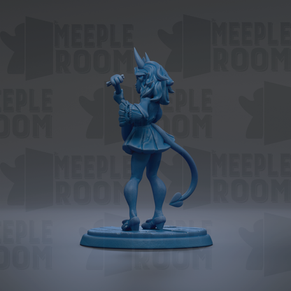 A blue figurine of a character with horns and a tail, standing on a blue base and holding a small object in its hand.