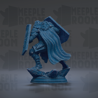 A blue statue of a warrior figure, wearing a cape and armor, standing on a base and holding a shield.