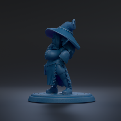 A blue figurine of a wizard or magical character standing on a platform.