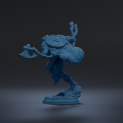 A blue figurine of a warrior figure with a large headdress and a shield, standing on a base and holding two weapons.