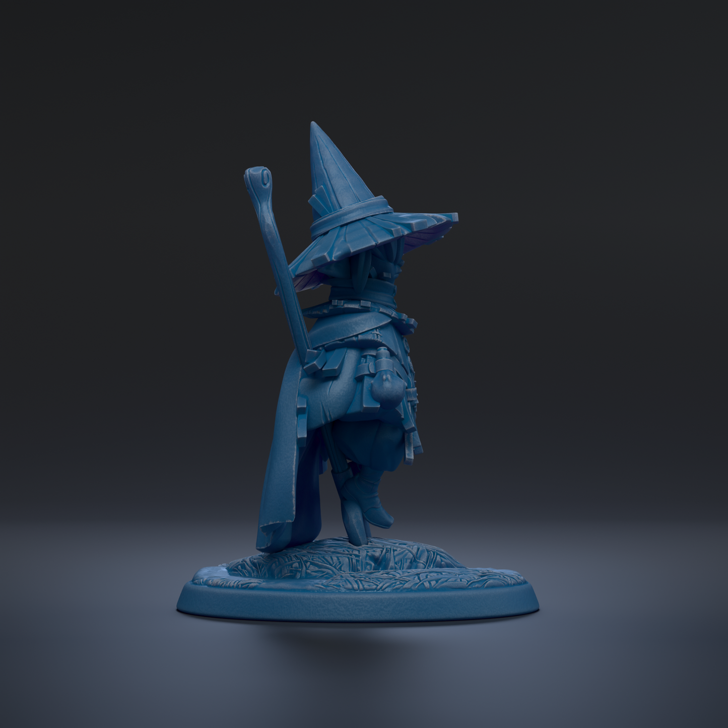 A blue figurine of a wizard or magical character standing on a base against a dark background.