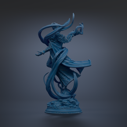 A blue statue of a figure with flowing robes and a flowing headdress, standing on a pedestal against a dark background.