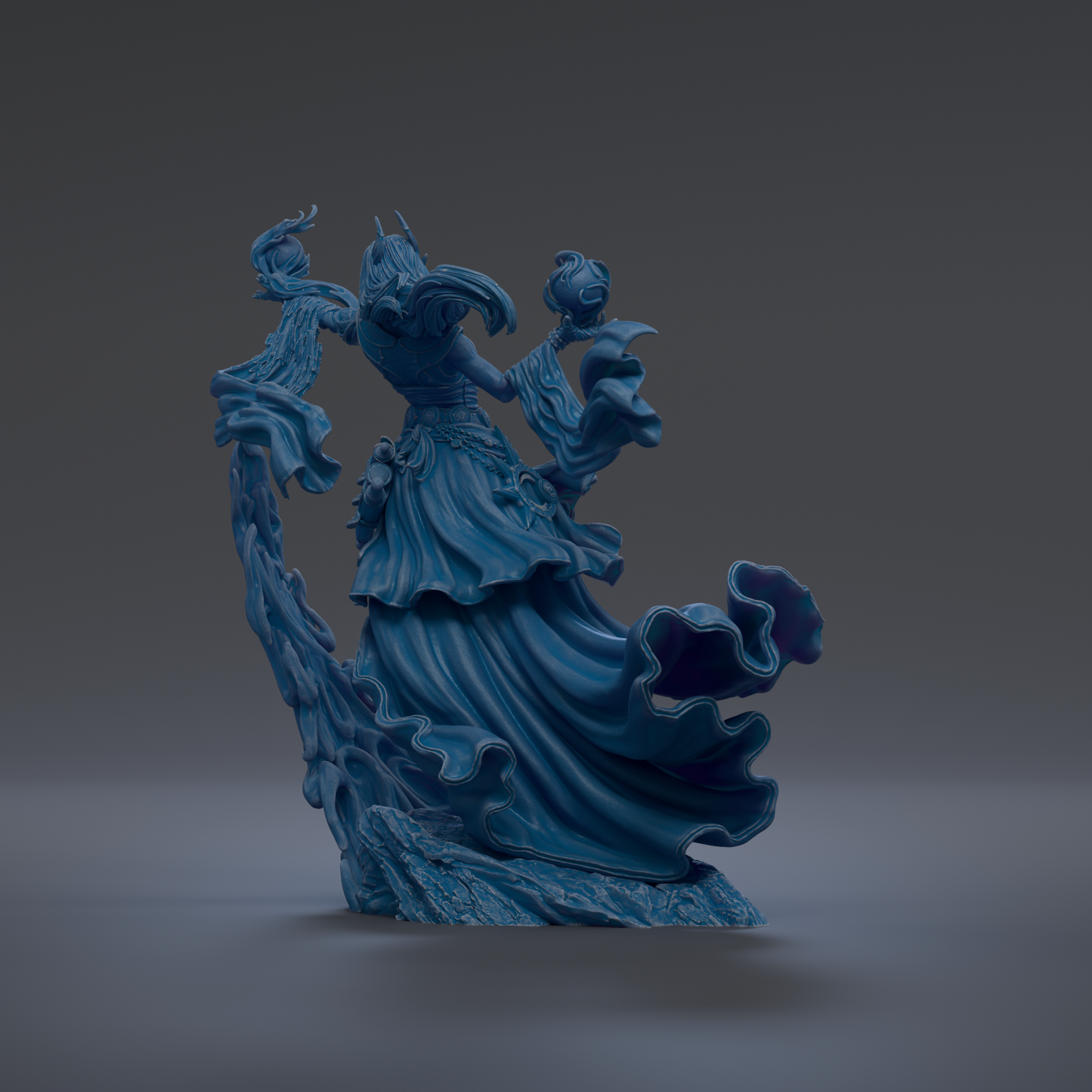 A blue, flowing statue of a figure with a long, flowing dress and a headdress, standing on a rock and holding a staff.