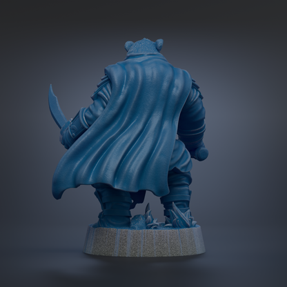 A 3D rendering of a blue-colored character with a cape, standing on a base and holding a weapon.