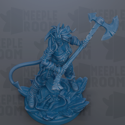 A blue figurine of a warrior wielding a large weapon, standing on a rocky base.