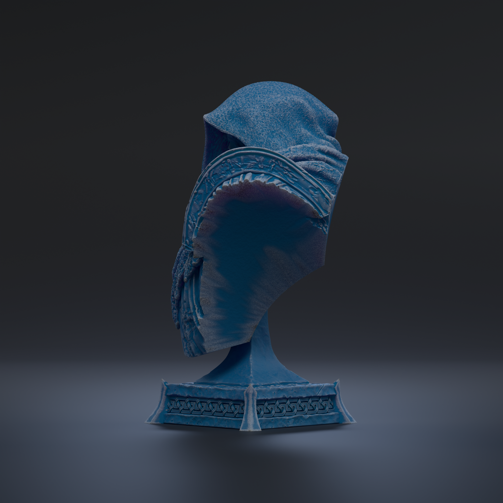 A blue, hooded object is displayed on a pedestal against a dark background.
