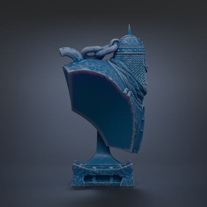 A blue bust of a person wearing a helmet with spikes, standing on a pedestal.