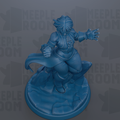A blue figurine of a person with a cape and a shield, standing on a rocky surface.