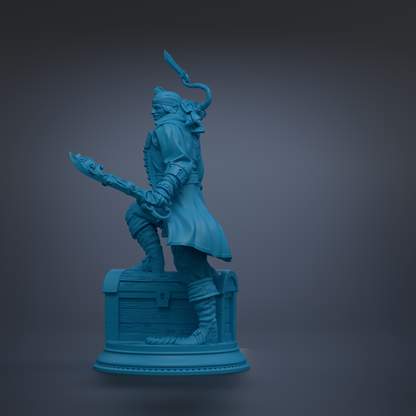 A blue statue of a pirate standing on a chest, holding a sword and wearing a hat.