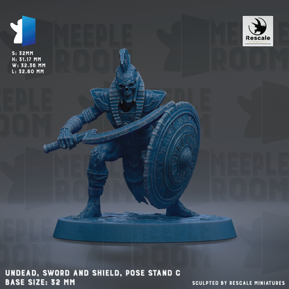 a figurine of a warrior standing on a base, holding a sword and shield. The figurine is in a pose that suggests readiness for battle. The figurine is made of a dark blue material, giving it a menacing appearance. The base size of the figurine is 32mm. The figurine is sculpted by Rescue Miniatures.