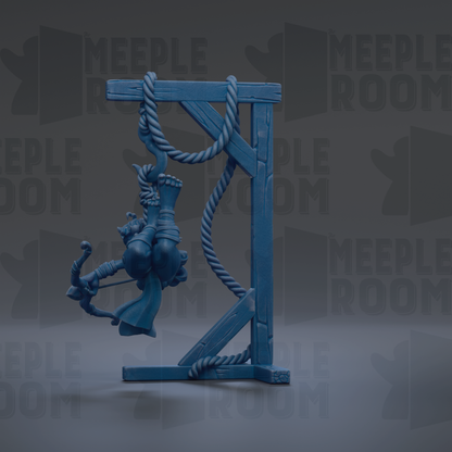 A blue figurine of a person hanging from a rope on a wooden stand, with the text "MEEPLE ROOM" repeated in the background.