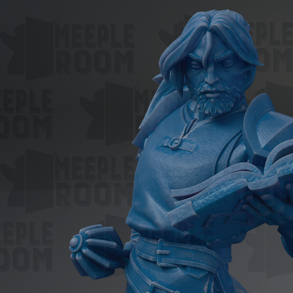 A close-up of a blue statue of a man with long hair and a beard, holding a book and appearing to be in a contemplative or thoughtful pose.