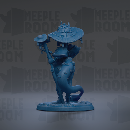 A blue figurine of a whimsical creature, possibly a dragon or a fantastical being, standing on a base and holding a mushroom-shaped object.