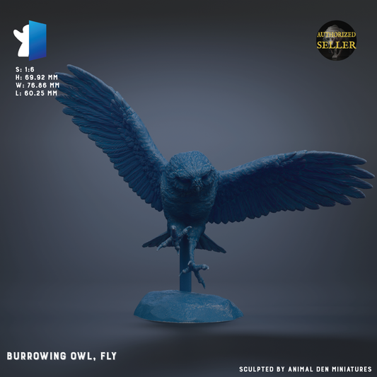 A blue sculpture of a flying owl, with its wings spread wide, is displayed on a stand.