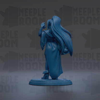 A blue figurine of a person with long hair, wearing a flowing robe, standing on a base and holding a staff.