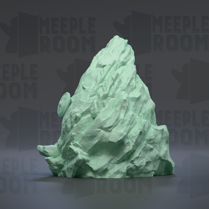 A large, green, rocky formation resembling a mountain or peak, with the word "MEIPL" visible in the background.