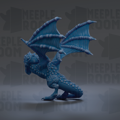 A blue dragon figurine with detailed wings and scales is the main focus of the image.