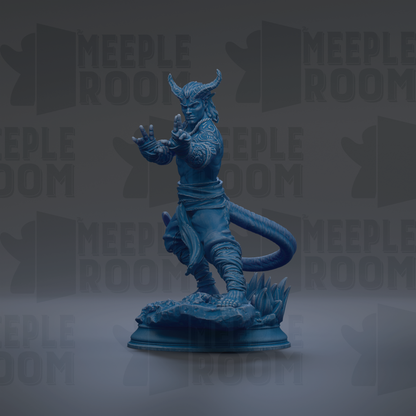 A blue figurine of a dragon-like creature with horns and a tail, standing on a rock formation against a dark background with repeated text.