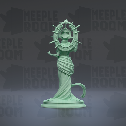 A green statue of a woman with a crown and a halo, standing on a pedestal.