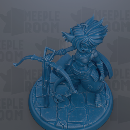 A blue figurine of a character with a pointed hat and sword, standing on a stone base.