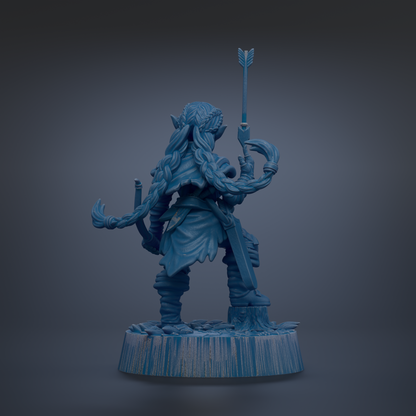 A blue figurine of a warrior figure holding a sword and shield, standing on a base.