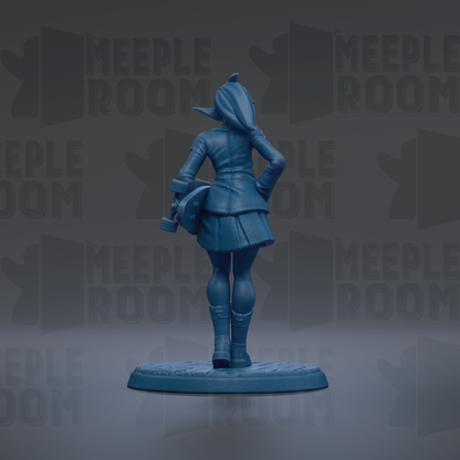 A blue figurine of a person standing with their back to the camera, wearing a coat and boots, and holding a skateboard.