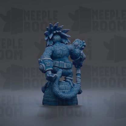 A blue, furry statue of a character with a large head and a staff, standing on a brick base.