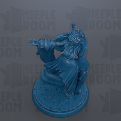 A blue figurine of a person with outstretched arms, standing on a circular base with a patterned design.