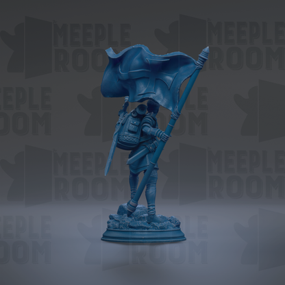 A blue statue of a person holding a flag, standing on a base.