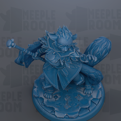 A blue figurine of a character with a sword and shield, standing on a rocky base.