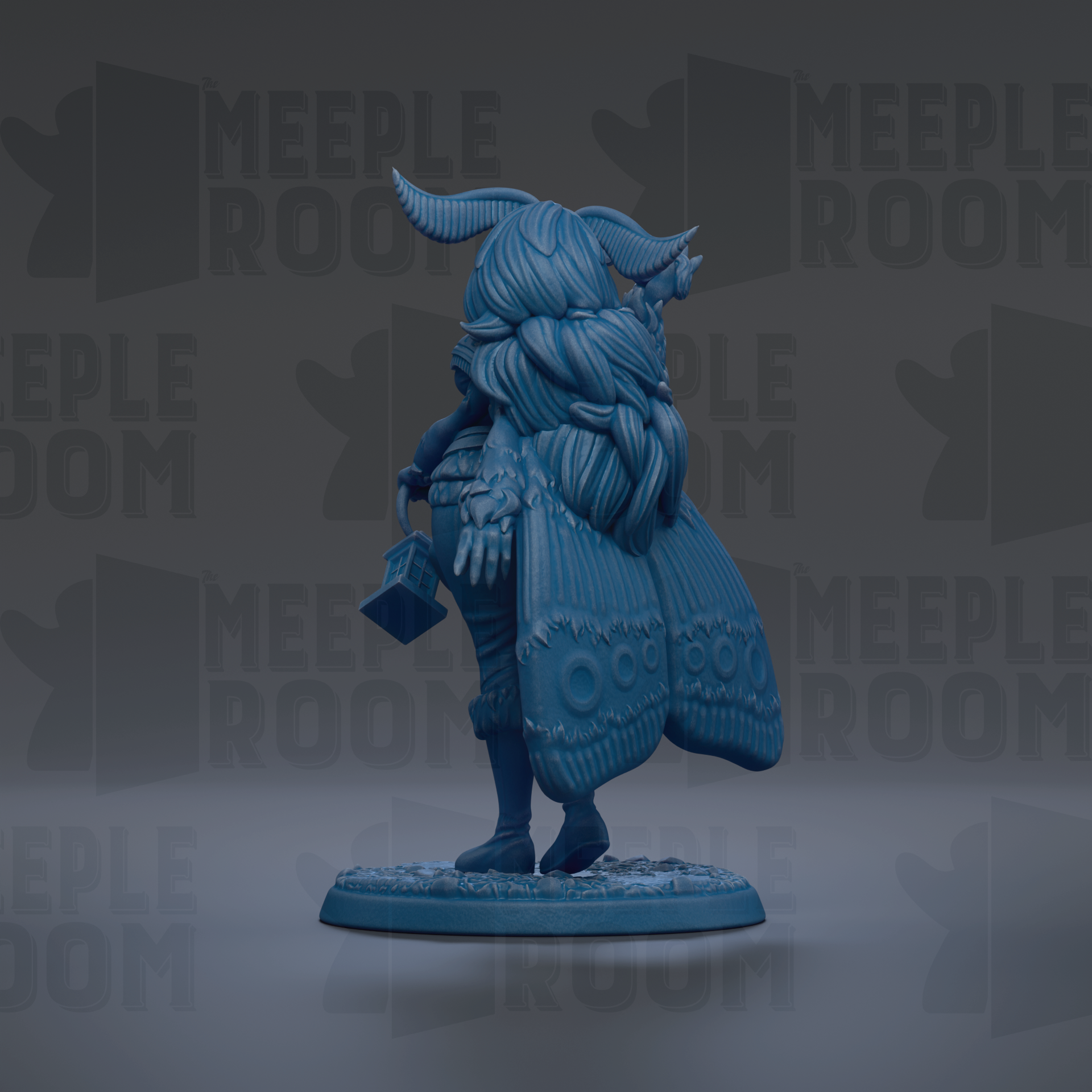 A blue figurine of a winged creature with a long tail, standing on a base and holding a small object in its hand.