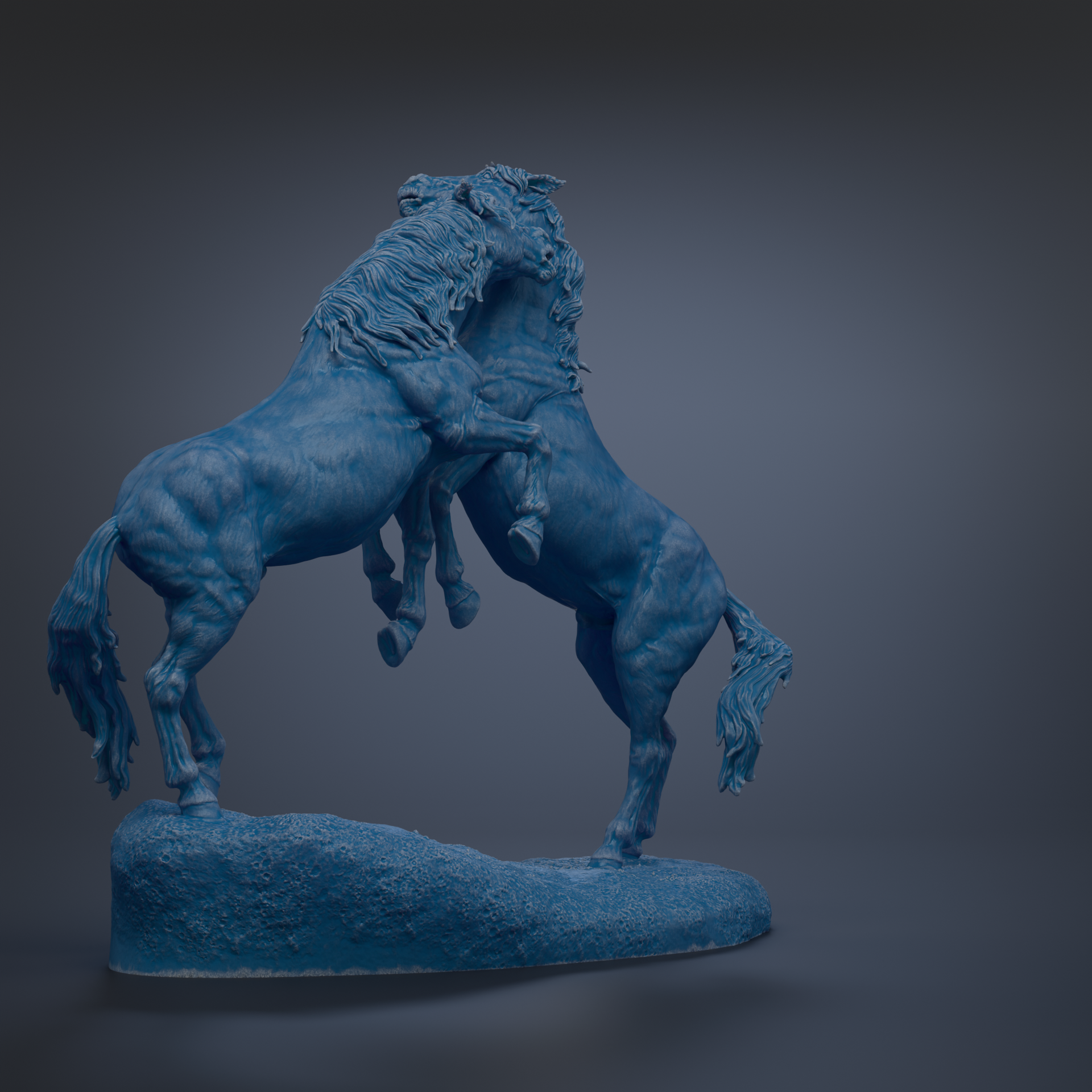 A blue statue of two horses standing on a rock, facing each other.