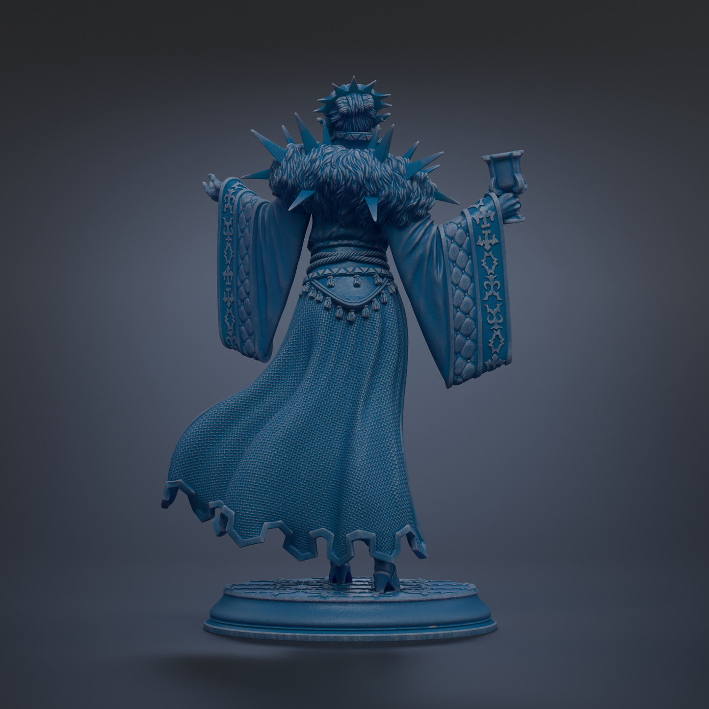 A statue of a person wearing a long, flowing robe with spikes on the shoulders, holding a cup in their hand.