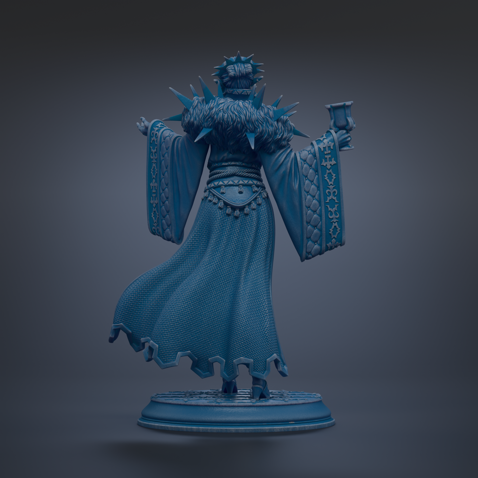 A statue of a person wearing a long, flowing robe with spikes on the shoulders, holding a cup in their hand.