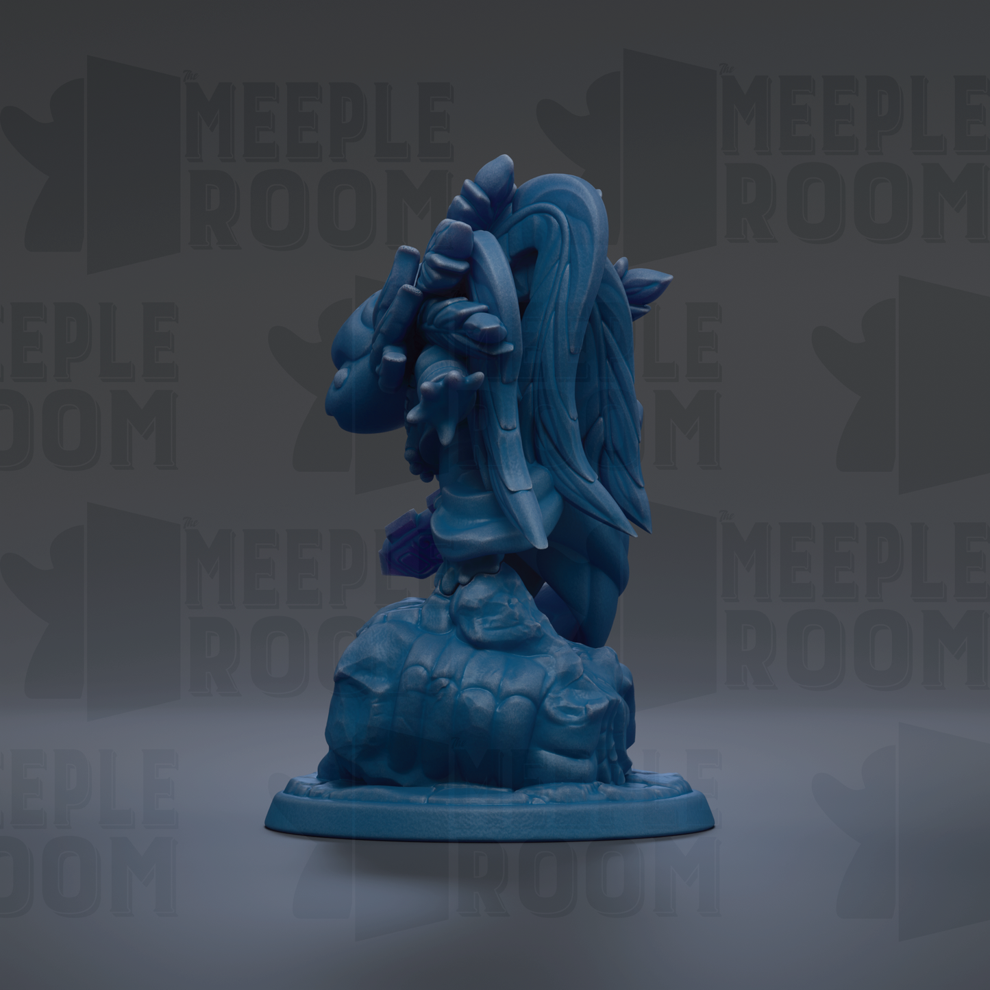 A blue figurine of a dragon-like creature with a long tail and wings, standing on a rock.