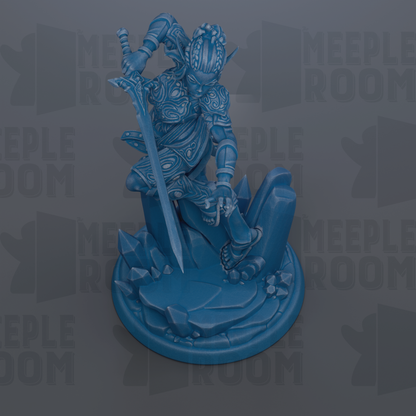 A blue figurine of a warrior figure holding a sword and standing on a rocky base.