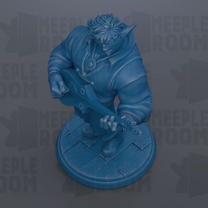 A blue figurine of a person playing a guitar.