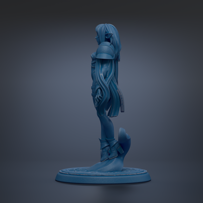 A blue figurine of a female character with long hair and a flowing skirt, standing on a circular base against a dark background.