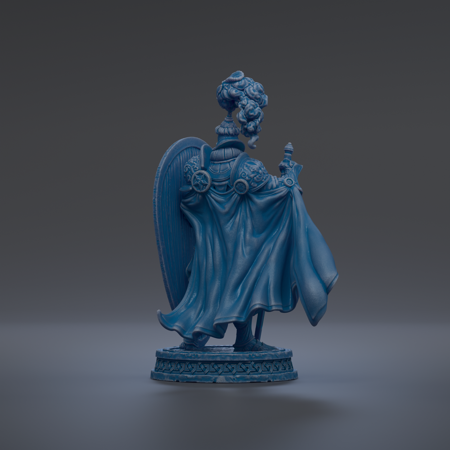 A blue statue of a figure with a flowing cape and a shield, standing on a base with a decorative design.