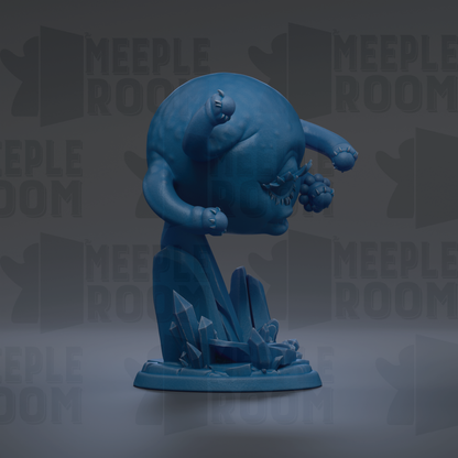 A blue, abstract figurine with a round head and two arms, standing on a base with crystals.