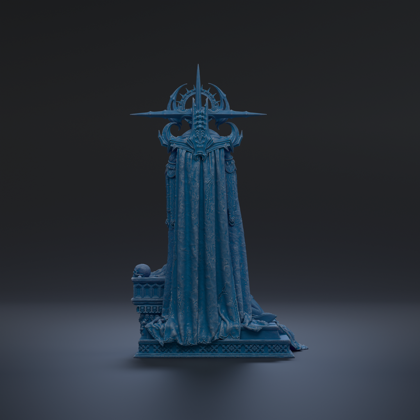A dark blue, ornate statue with a pointed top and intricate designs, standing alone against a dark background.