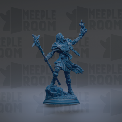 A blue figurine of a warrior standing on a rock, holding a staff and a shield, with a raised fist.