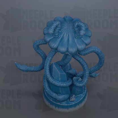 A blue, abstract sculpture resembling a flower or plant with long, curving stems and leaves.