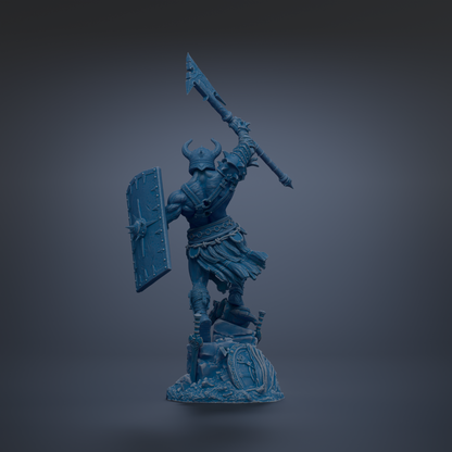 A blue warrior statue with a shield and sword, standing on a rock and holding a spear.