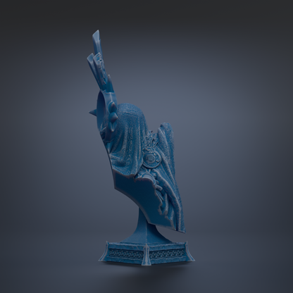 A blue, abstract sculpture with a textured, organic shape stands on a pedestal against a dark background.