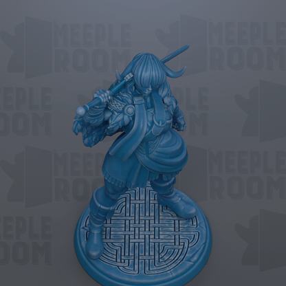 A blue figurine of a warrior standing on a circular base with a geometric pattern.