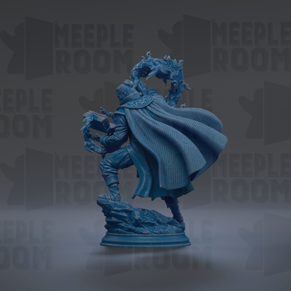 A blue statue of a person with a flowing cape, standing on a rock and holding a book.