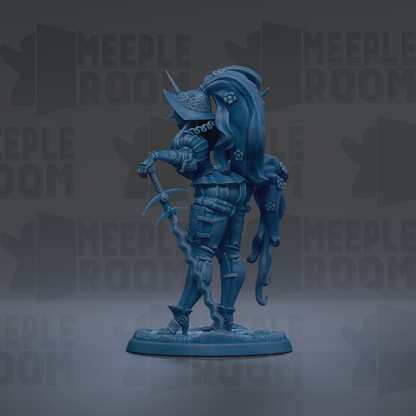 A blue figurine of a knight-like character with a long, flowing cape and a sword, standing on a base.